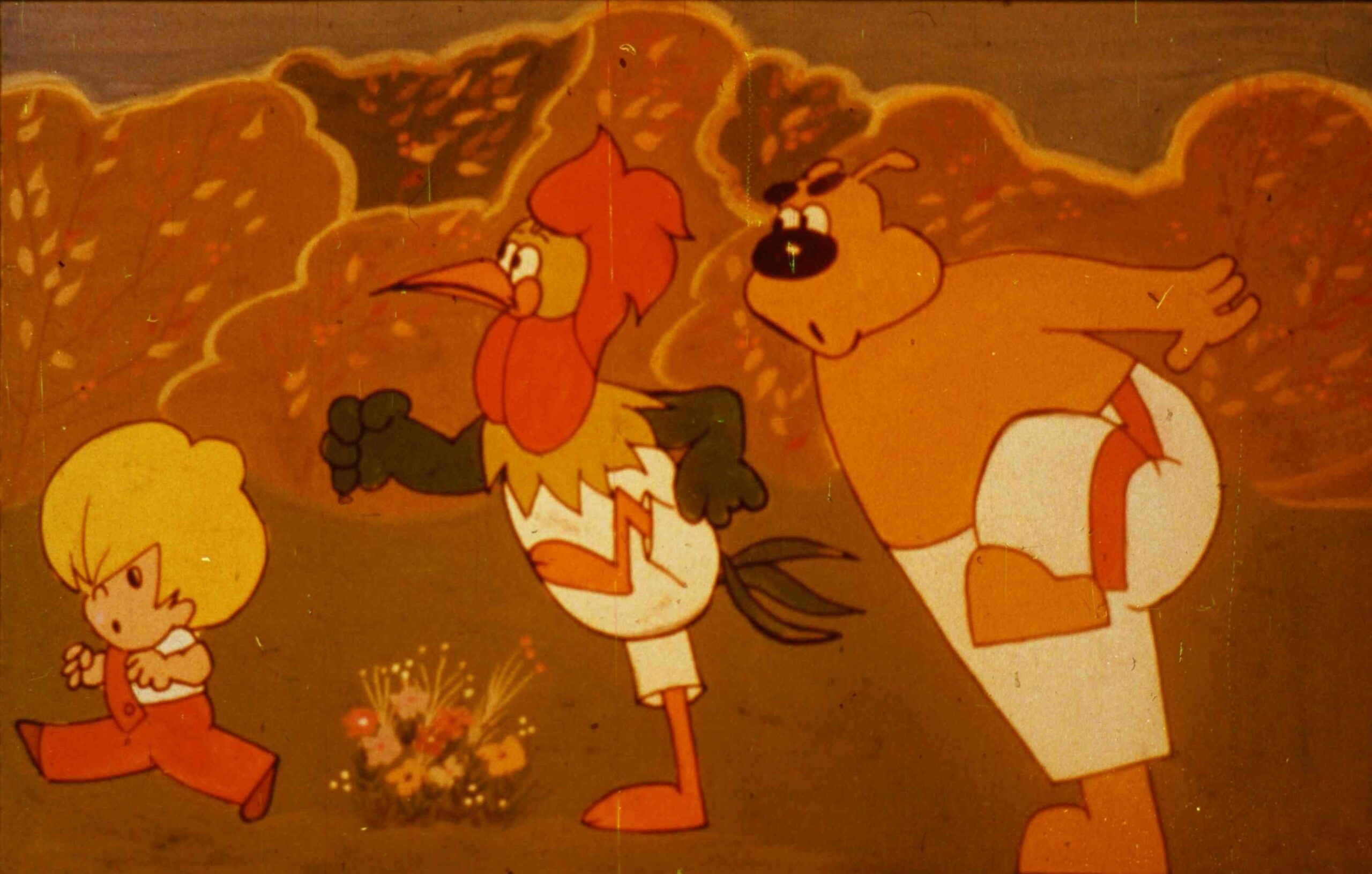 Imagine dintr-un desen animat cu trei personaje care aleargă într-un peisaj de toamnă.