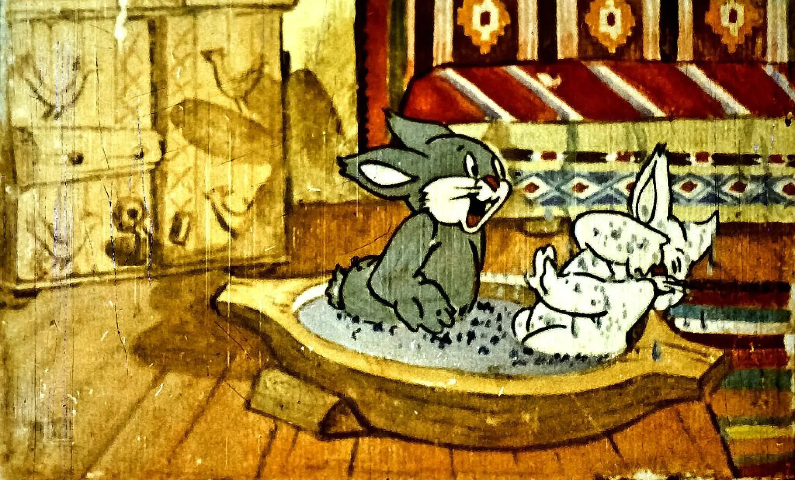 Imagine cu două personaje animate, un iepure și o pisică, care discută despre pregătirile lor pentru un eveniment.