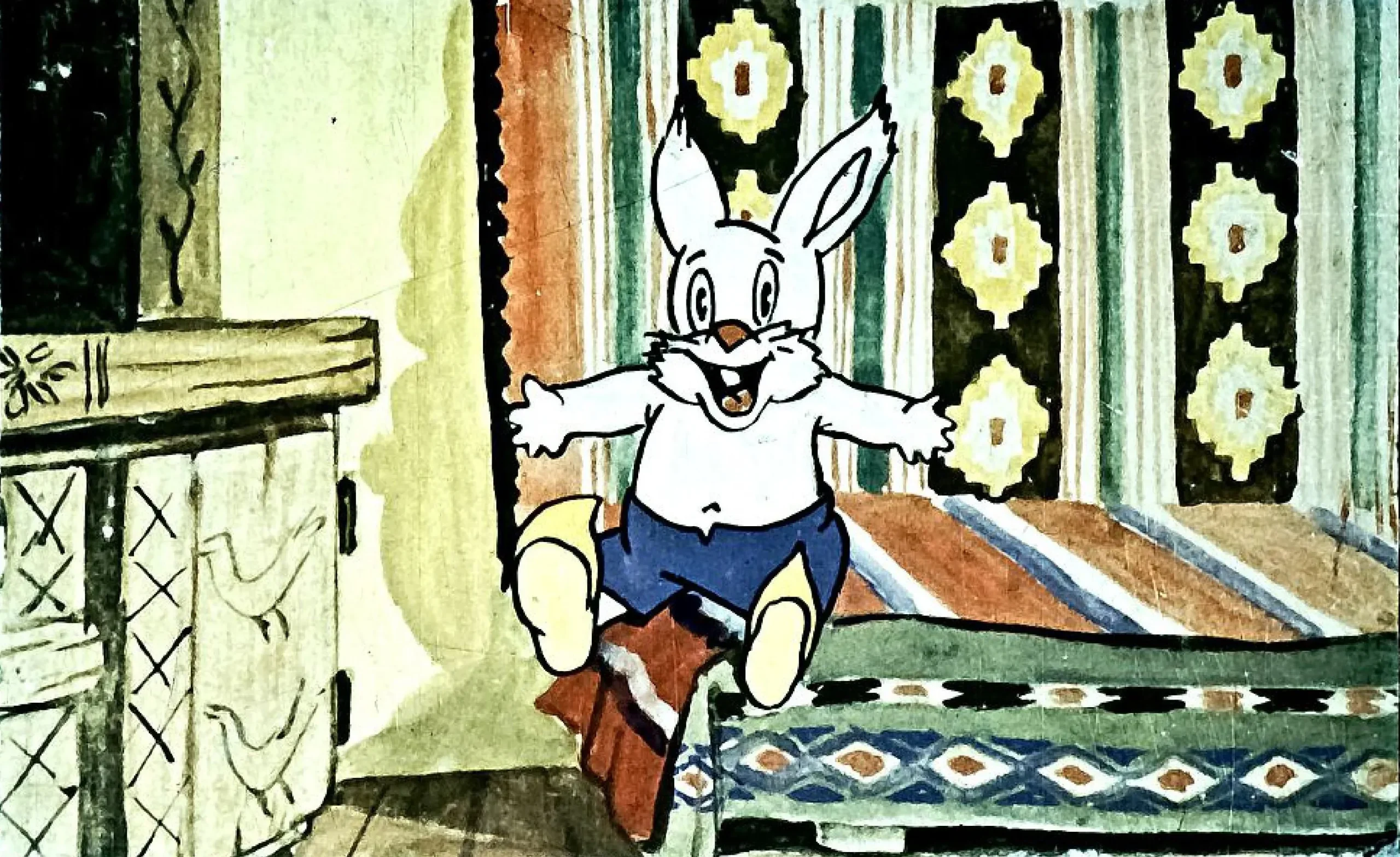 Un personaj animat, un iepure, stă pe o canapea, zâmbind și vorbind cu entuziasm.