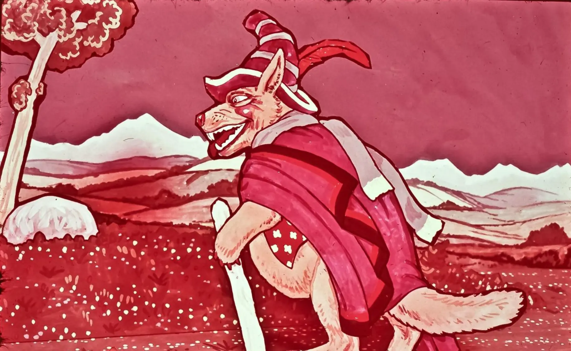 Imaginea unui câine antropomorfizat, purtând o pălărie de vrăjitor și o rochie colorată, pe un fundal cu peisaje montane și copaci.