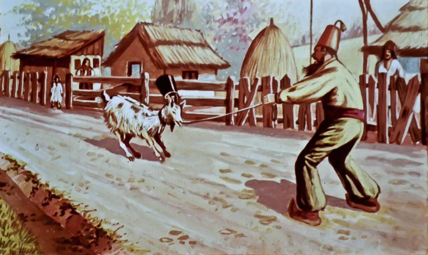 Un bărbat trage de o capră pe o stradă, în timp ce gospodării tradționale se văd în fundal.