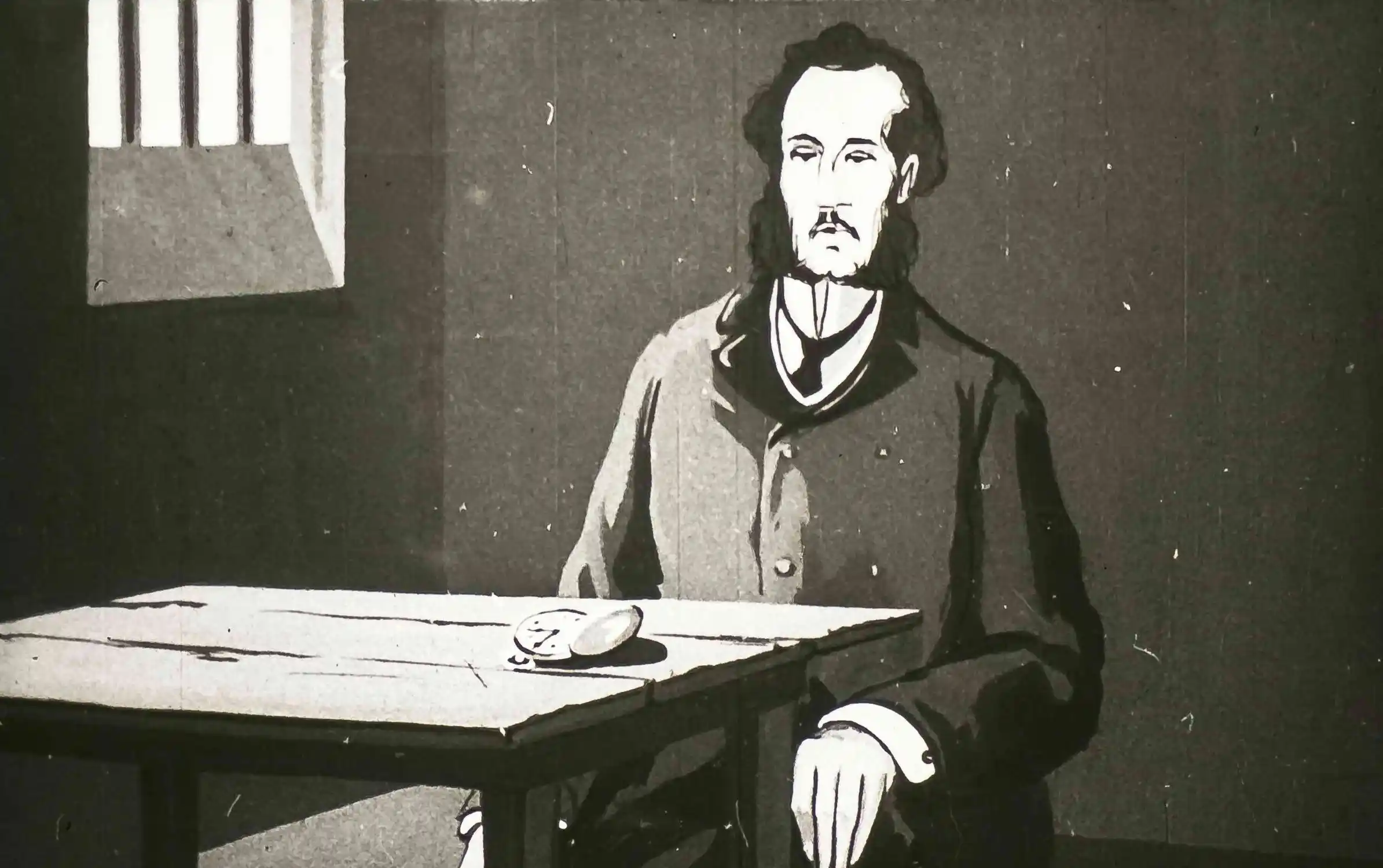 Un om îmbrăcat în costume de epocă stă la o masă într-o cameră, cu graffiti vizibil pe pereți, sugerând o scenă dintr-o închisoare.