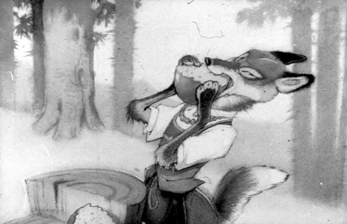 O vulpe desene animate, îmbrăcată în costumul tradițional, ținând în gură un măr, cu un fundal de pădure.